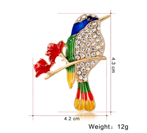 Detail of colorful hummingbird brooch showing 4.3cm size and sparkling rhinestone inlay