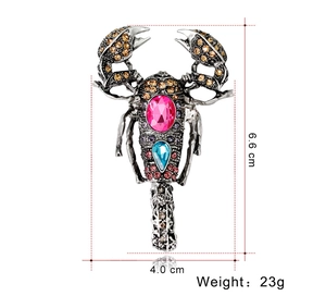 Detailed view of vintage scorpion brooch showing dimensions 6.6cm by 4.0cm and 23g weight
