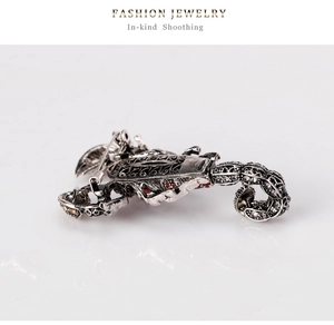 Detailed back view of a scorpion brooch with a secure safety pin clasp on vintage alloy