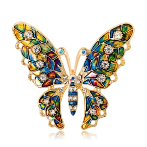 Élégante broche papillon en émail coloré avec strass brillants et finition dorée