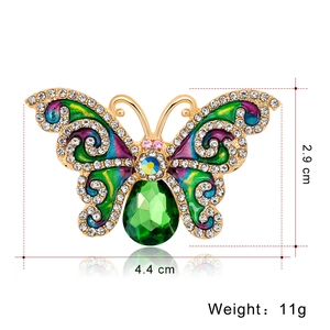 Spilla artistica a forma di farfalla con smalto colorato e pietra preziosa verde