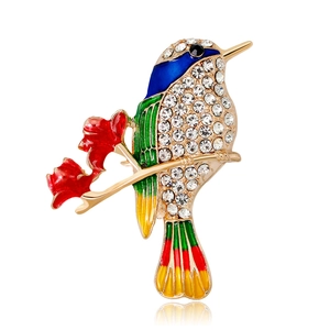 Colorful bird brooch with sparkling crystals and enamel floral branch in gold-tone finish