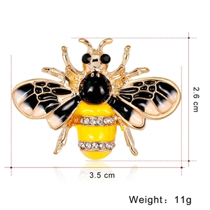 Vintage bee brooch with yellow enamel and sparkling crystals on a gold alloy base