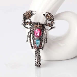 Vintage scorpion brooch with champagne rhinestones and colorful crystal gems in retro style