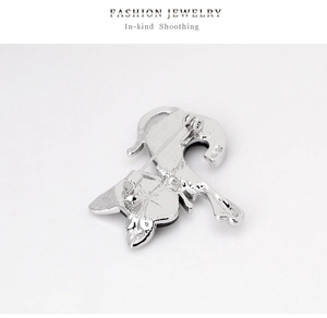Detail view of the silver cat brooch back showing polished finish and secure pin clasp