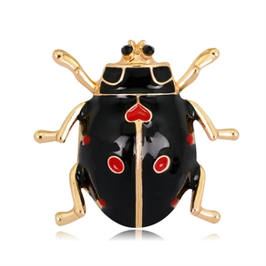 Creative ladybug brooch with red heart patterns and gold metal legs on white background