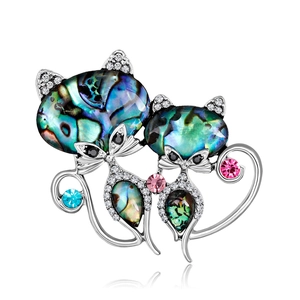 Fashionable double cat brooch featuring colorful abalone shell and crystal accents