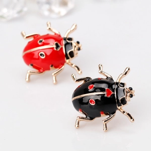Creative ladybug brooches set in red and black enamel with sparkling crystal eyes