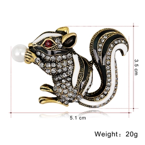 Cute squirrel brooch in gold alloy with white rhinestones and a pearl accent, 5.1cm