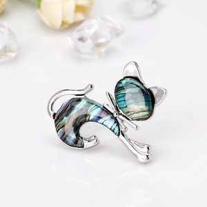 Vintage cat brooch with colorful abalone shell inlays and silver metal frame for women