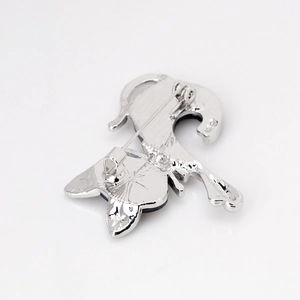 Vintage cat shell brooch in silver finish showing back pin details and sturdy metal craft