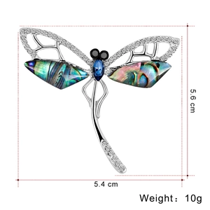 Vintage dragonfly brooch with colorful abalone wings and crystals measuring 5.4 x 5.6 cm