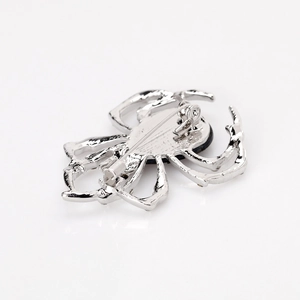 Broche araignée en alliage argenté avec pierre précieuse noire ovale centrale