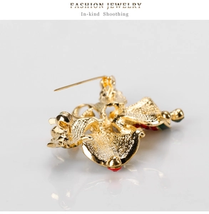 Detailed back view of vintage gold bell brooch showing pin clasp and casting texture