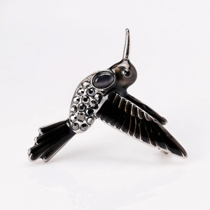 Eleganter Kolibri-Anstecknadel mit schwarzer Emaille und Strasssteinen auf grauem Metall