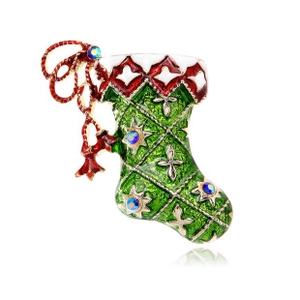 Detailed view of green enamel Christmas stocking brooch with blue rhinestones and gold accents