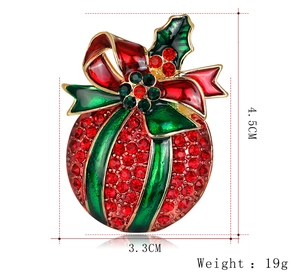Detail view showing dimensions of red rhinestone Christmas ball brooch with green enamel