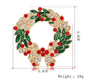 Detailed size view of Christmas wreath brooch measuring 4.6cm by 4.4cm with gold alloy