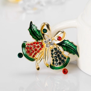 Vintage Christmas brooch with gold bells, holly leaves, and red green crystals