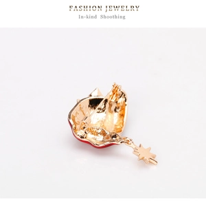 Detailed back view of Christmas hat brooch showing gold alloy pin clasp and star charm