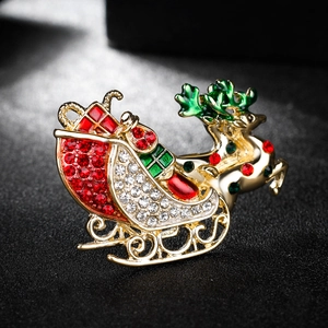 Broche de traîneau de renne de Noël étincelante avec des strass colorés sur fond noir