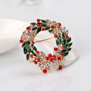Elegant Christmas wreath brooch with green enamel and sparkling red and white crystals