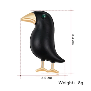 Creative black crow brooch with golden beak and green gem eye, size 3.4x3.0 cm