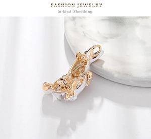 Detailed back view of a rabbit animal brooch with a gold-plated safety pin fastener