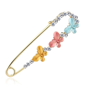 Goldene Schmetterlingsbrosche mit funkelnden Strasssteinen in Gelb, Rosa und Blau