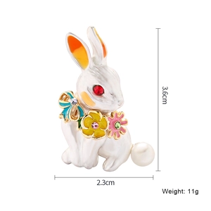 Creative white enamel rabbit brooch with crystal details and dimensions 3.6cm by 2.3cm