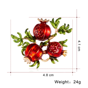 Vintage pomegranate brooch in red enamel and gold finish, size 4.8cm x 4.1cm