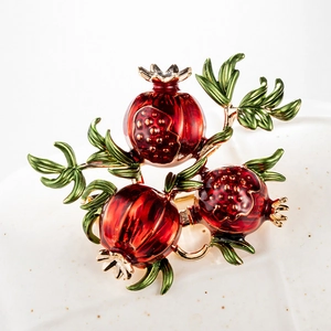 Vintage pomegranate brooch with red enamel fruits and green leaves on gold alloy