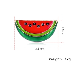 Detail view of a 3.5cm watermelon brooch with red enamel and black rhinestones