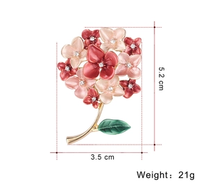 Detailed dimensions of floral brooch with red enamel petals and white rhinestones