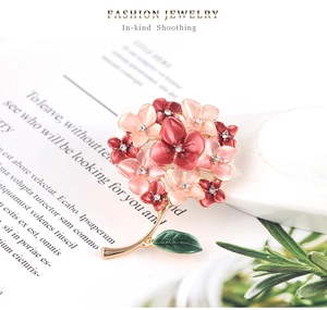 Detail of flower brooch with gradient enamel petals and sparkling rhinestones