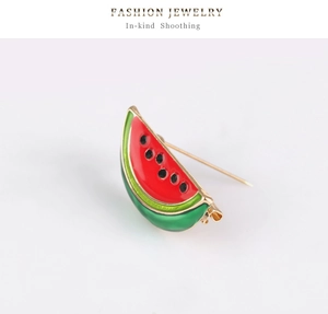 Detail view of the alloy watermelon brooch showing vibrant enamel colors and metal pin