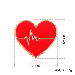 Detail of red heart enamel brooch showing dimensions 3.4cm width and 3.1cm height