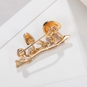 Golden rabbit and mushroom brooch with secure rotating safety pin on back view