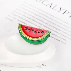 Minimalist watermelon brooch with red green enamel and black rhinestones in gold setting
