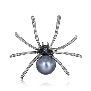 Exaggerated gothic spider brooch featuring a large grey pearl and black zircon crystals