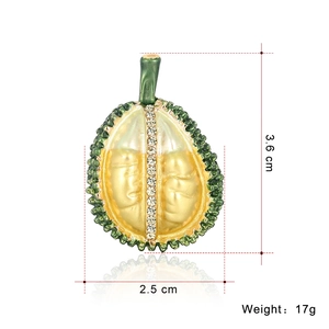 Exaggerated durian fruit brooch in green alloy with yellow pulp and white crystals