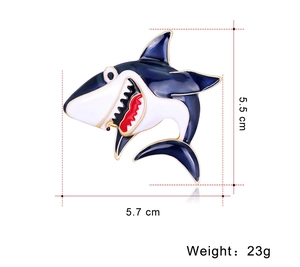 Detailed size specifications for cartoon shark brooch: 5.5cm height, 5.7cm width, 23g weight
