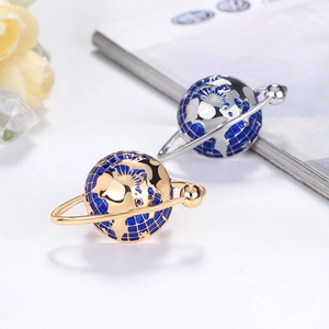 Modern universe globe enamel brooch in gold and silver finish with detailed longitude lines