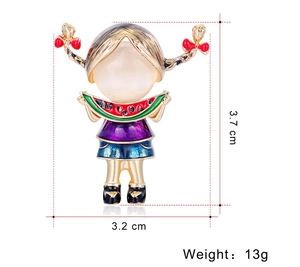 Detail view of cartoon girl brooch with red bow and watermelon slice showing dimensions