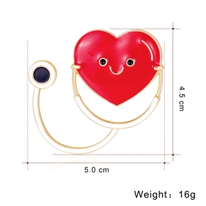 Detail showing red heart stethoscope brooch dimensions 5.0cm x 4.5cm and 16g weight