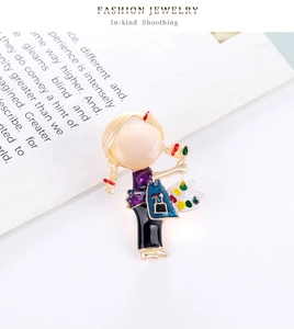 Detailed close-up of a painter girl alloy brooch with vibrant enamel purple clothes