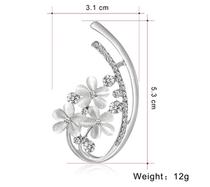 Broche fleur argentée avec pierres œil de chat blanches et strass, taille 3,1x5,3cm