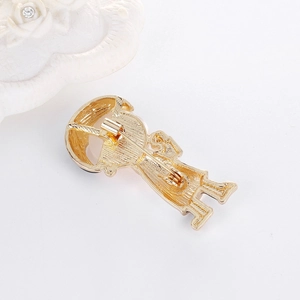 Detail view of the secure safety pin clasp on a gold-plated heart monitor brooch back