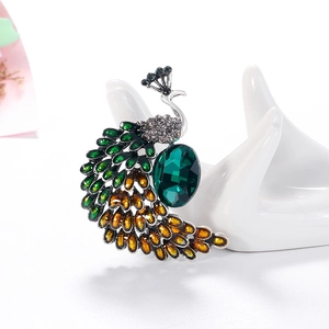 Broche paon vintage en alliage d'argent avec cristaux vert émeraude sur socle céramique