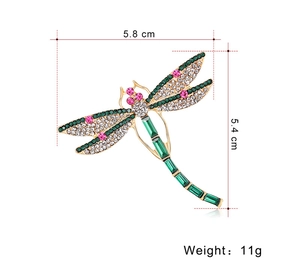 Detailed dragonfly brooch with rhinestones and gems, measuring 5.8 cm by 5.4 cm